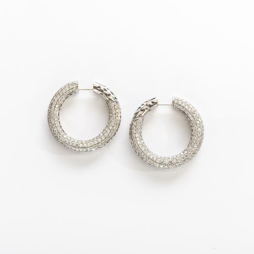 A pair of hoop earrings with diamonds