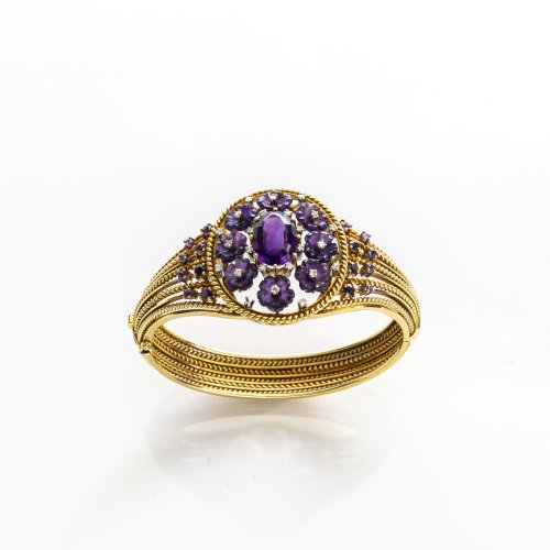 Opulent amethyst bangle with flower decoration