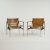 Two '657' - 'Sling' armchairs, 1960 (design)